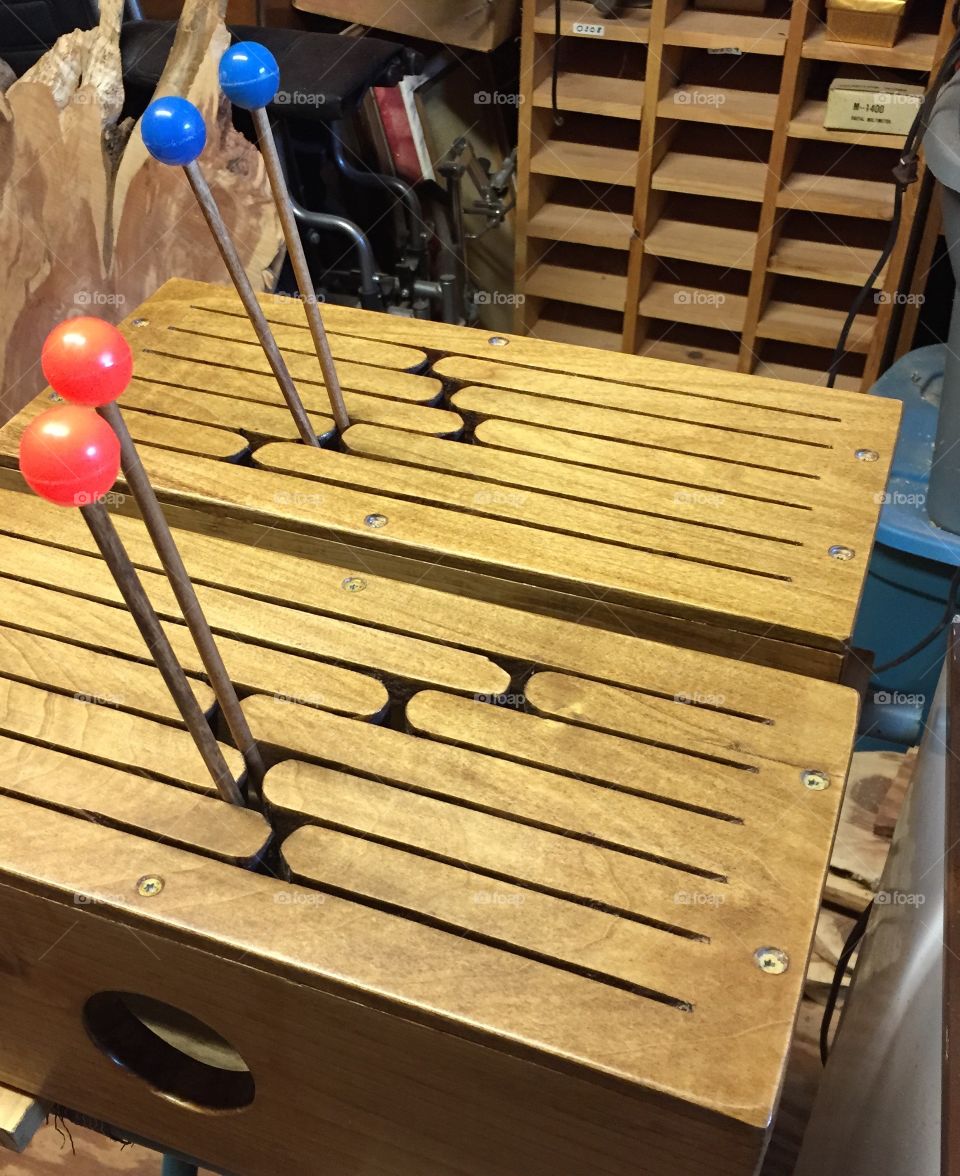 Wooden  oak and pine 12 tongue musical drum with wooden sticks.
