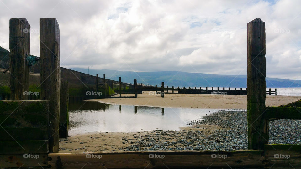Reflections on the beach in Barmouth, Wales