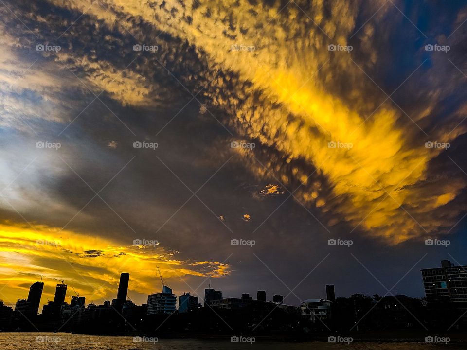 City silhouette under the orange burning night sky