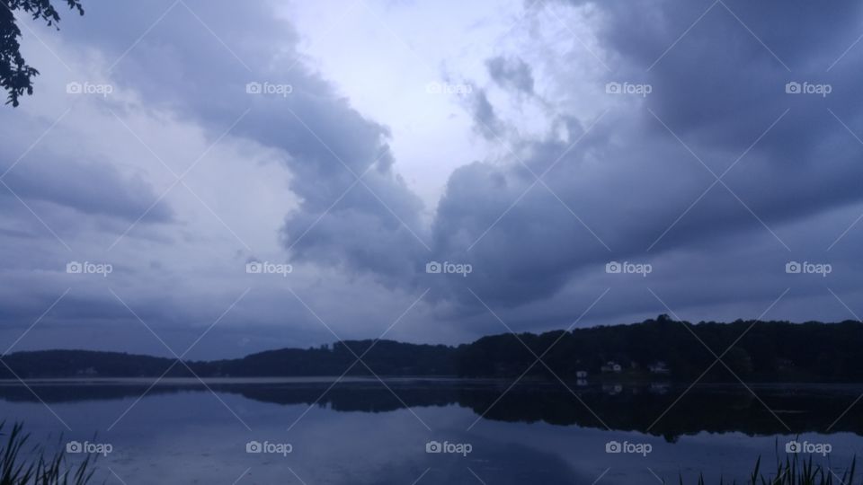 Storm clouds reflected on lake