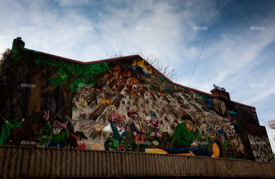 Deforestation (an important national problem) illustrated in mural - Bucharest, Romania