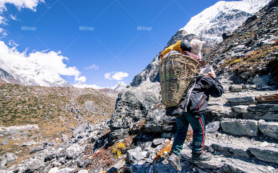 Carrying pottery during mountain trek, Nepal.