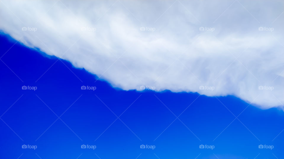 Blue sky and clouds with abstract background