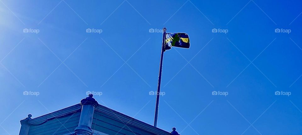 This flag is waving in the skies over „Malmö“, „Sweden“ by the „Baltic Sea“ on a bright sunshiny day in August of 2023. Hypnotic Productions