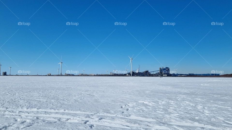 Outokumpu Oyj Steel factory in Tornio, Finnish Lapland. Windmills by the se making electricity.