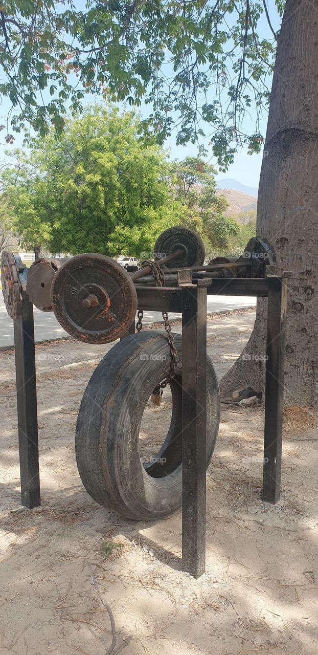 outdoor heavy exercise station, wheels, dumbbells, round, circles