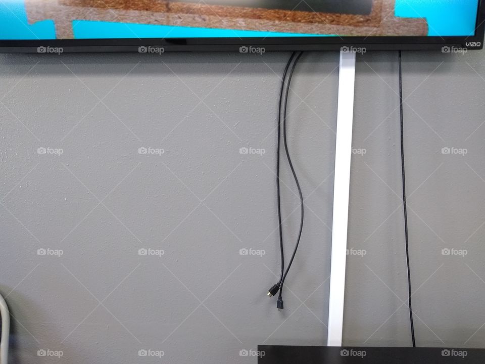 big screen TV with wires dangling