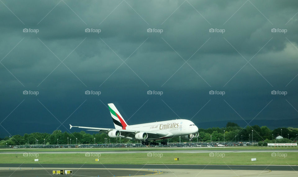 An Emirates A380 Airbus lands at Manchester Airport