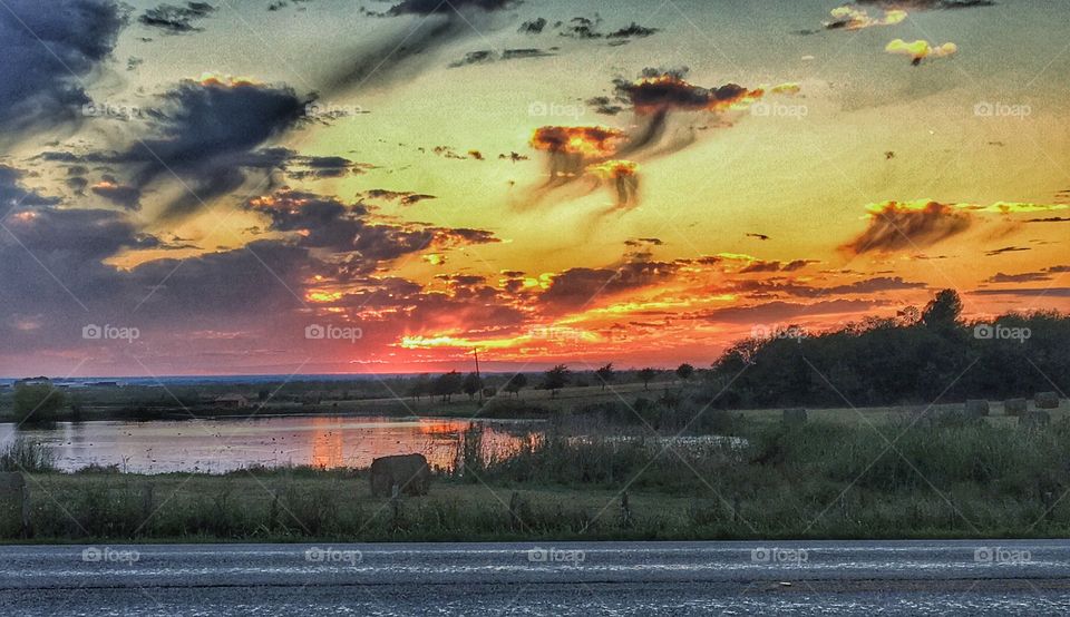 Dramatic sky reflected on river