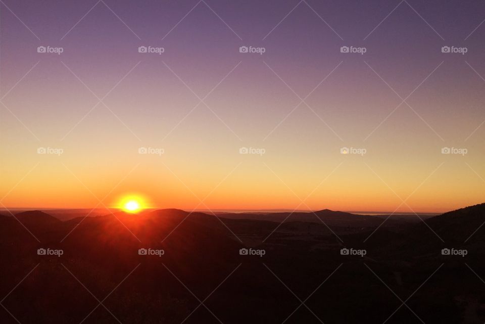Scenic view of mountain at sunset