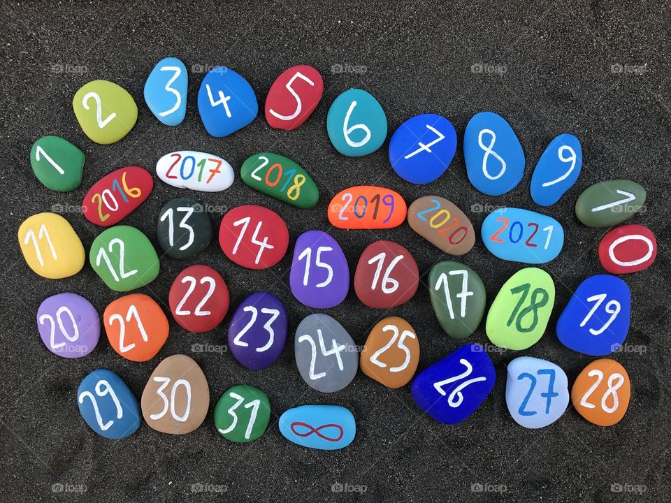 Happy New Year with multicolored stones and 31 numbers 