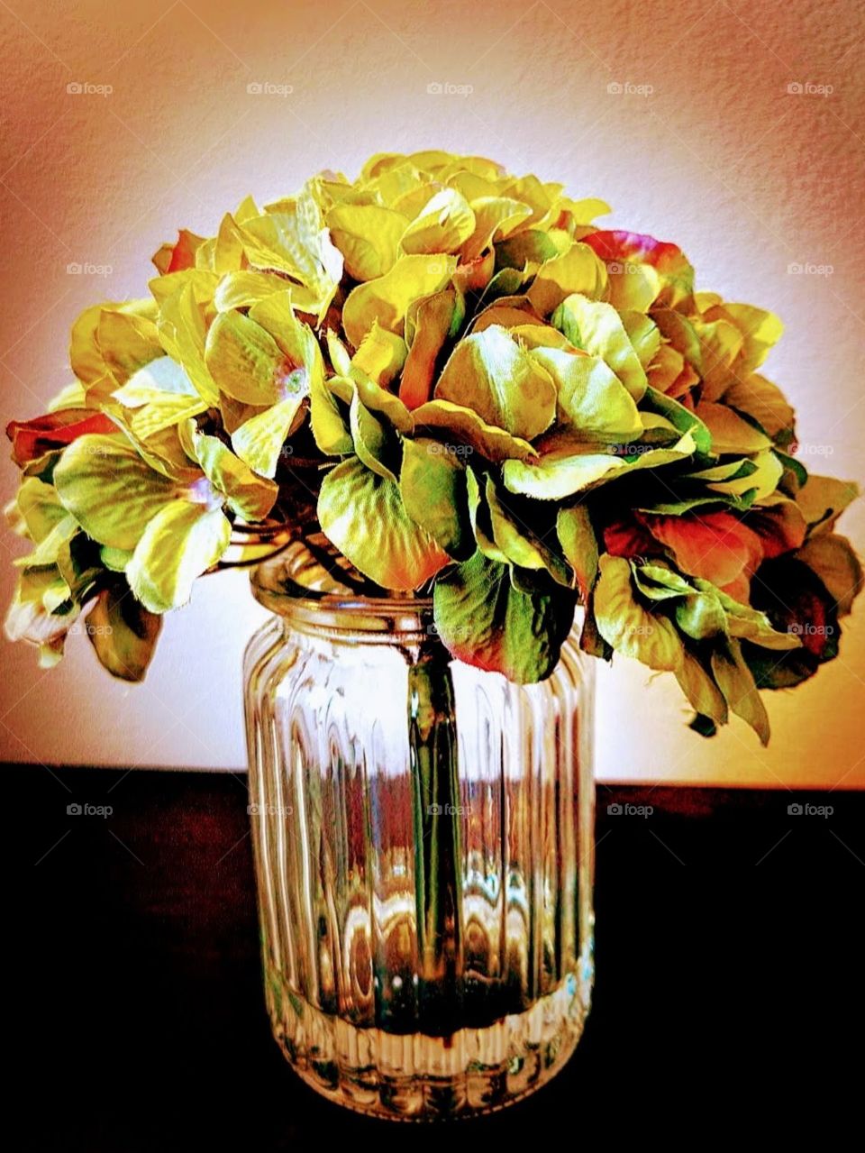 green Hydrangea flowers in a glass vase