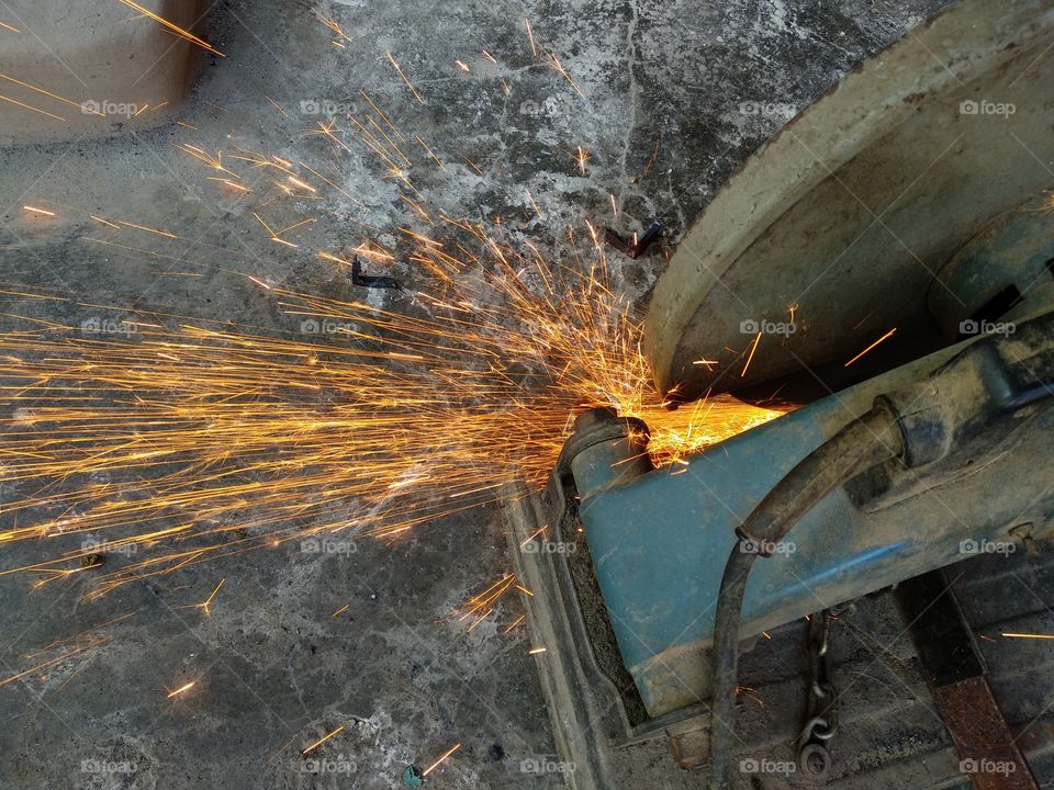 grinder while cutting metal