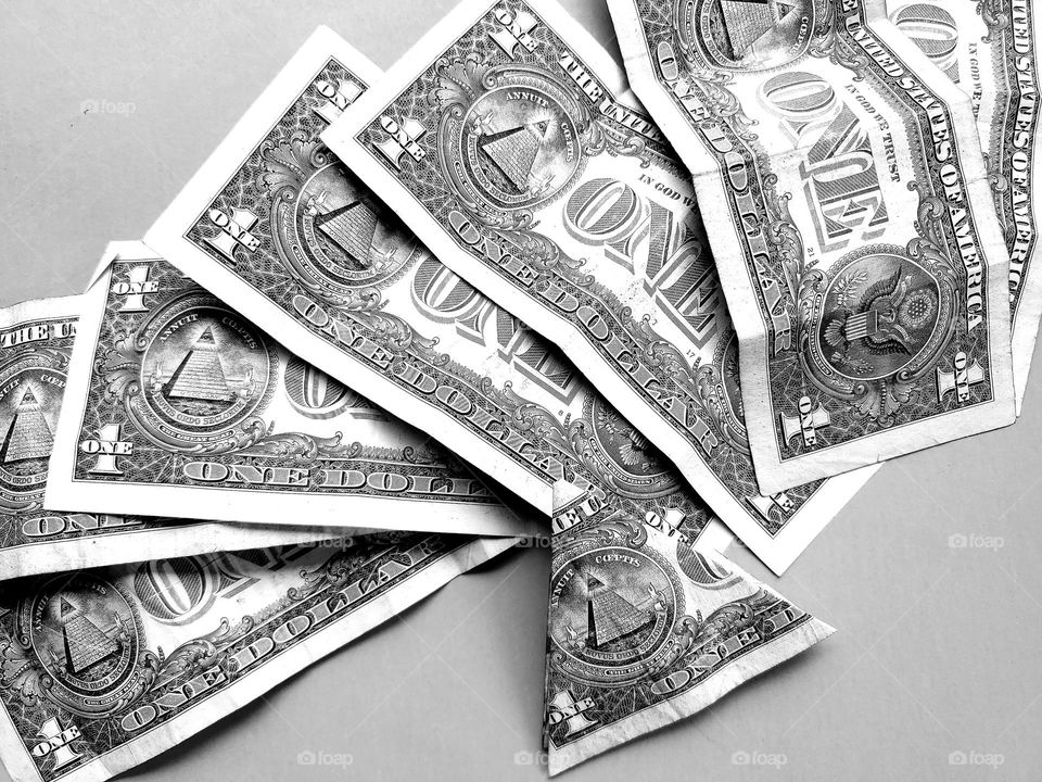 Dollars in black and white with emphasis on triangles.