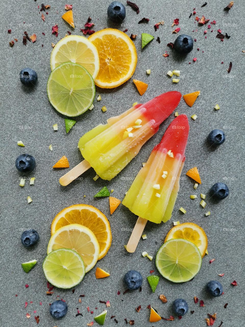 Summer treats, summer mood, summer time. Delicious and juicy ice lollies and fruits. Iced juice. Good choice for hot summer days. Refreshing snacks. 
