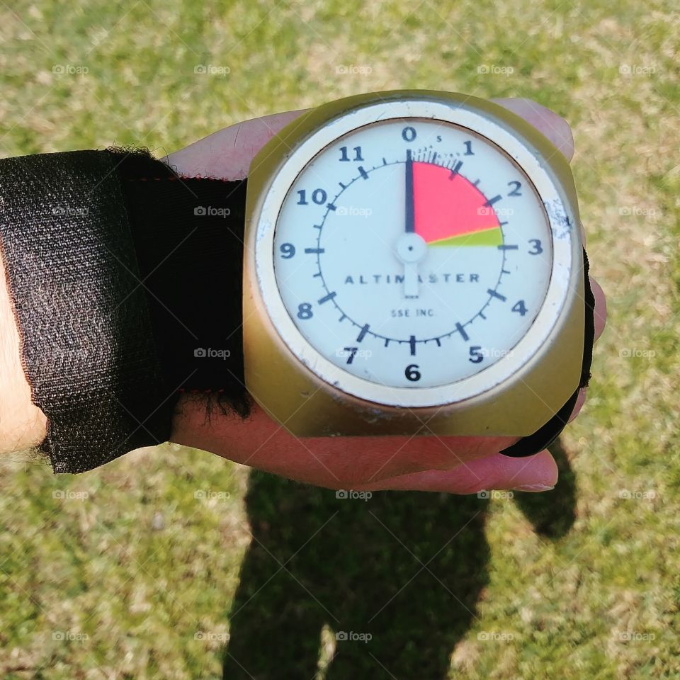 skydiving altimeter device on hand