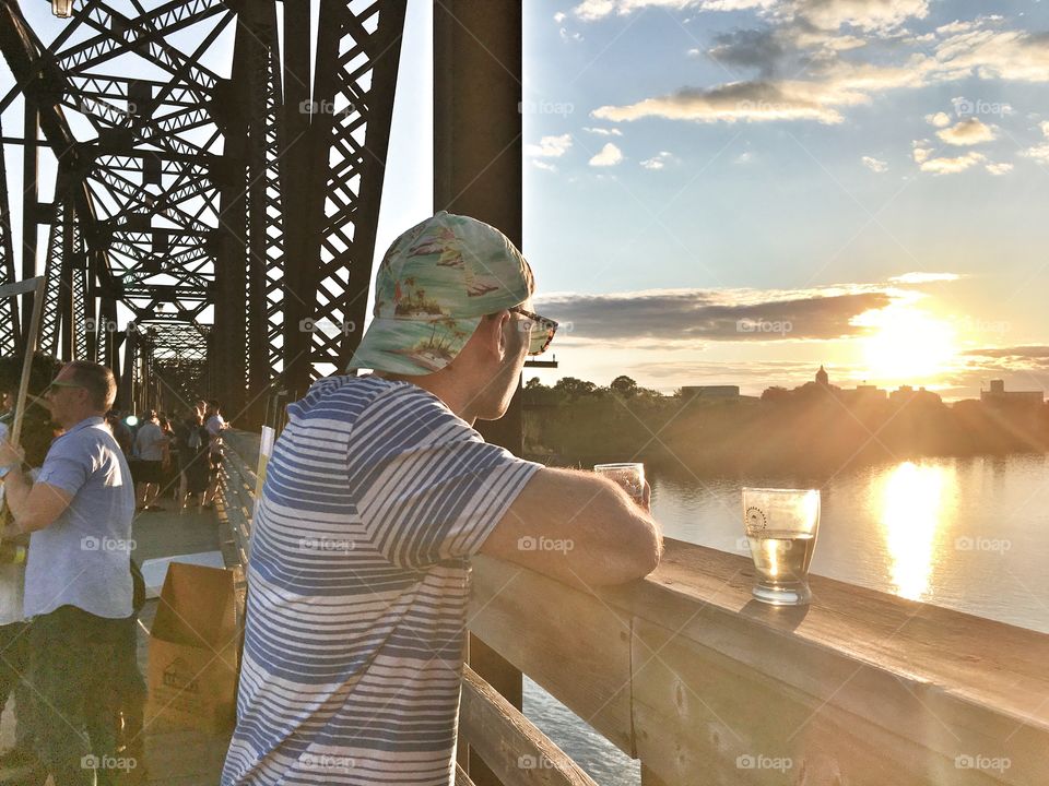 Sunset on the walking bridge in Fredericton, New Brunswick Canada. 1st annual Beer on the Bridge festival. 