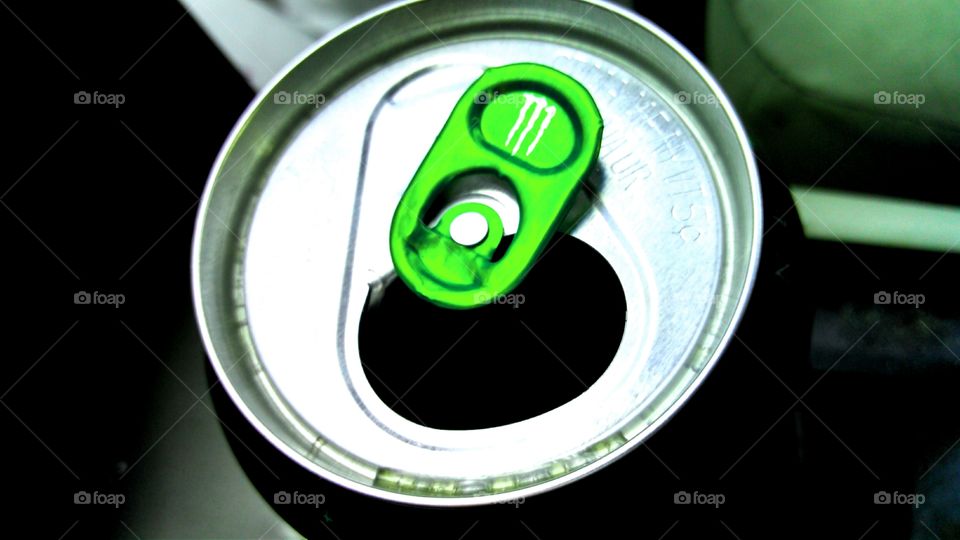 Monster Energy. Open can of Monster Energy Drink. Close-up photo.