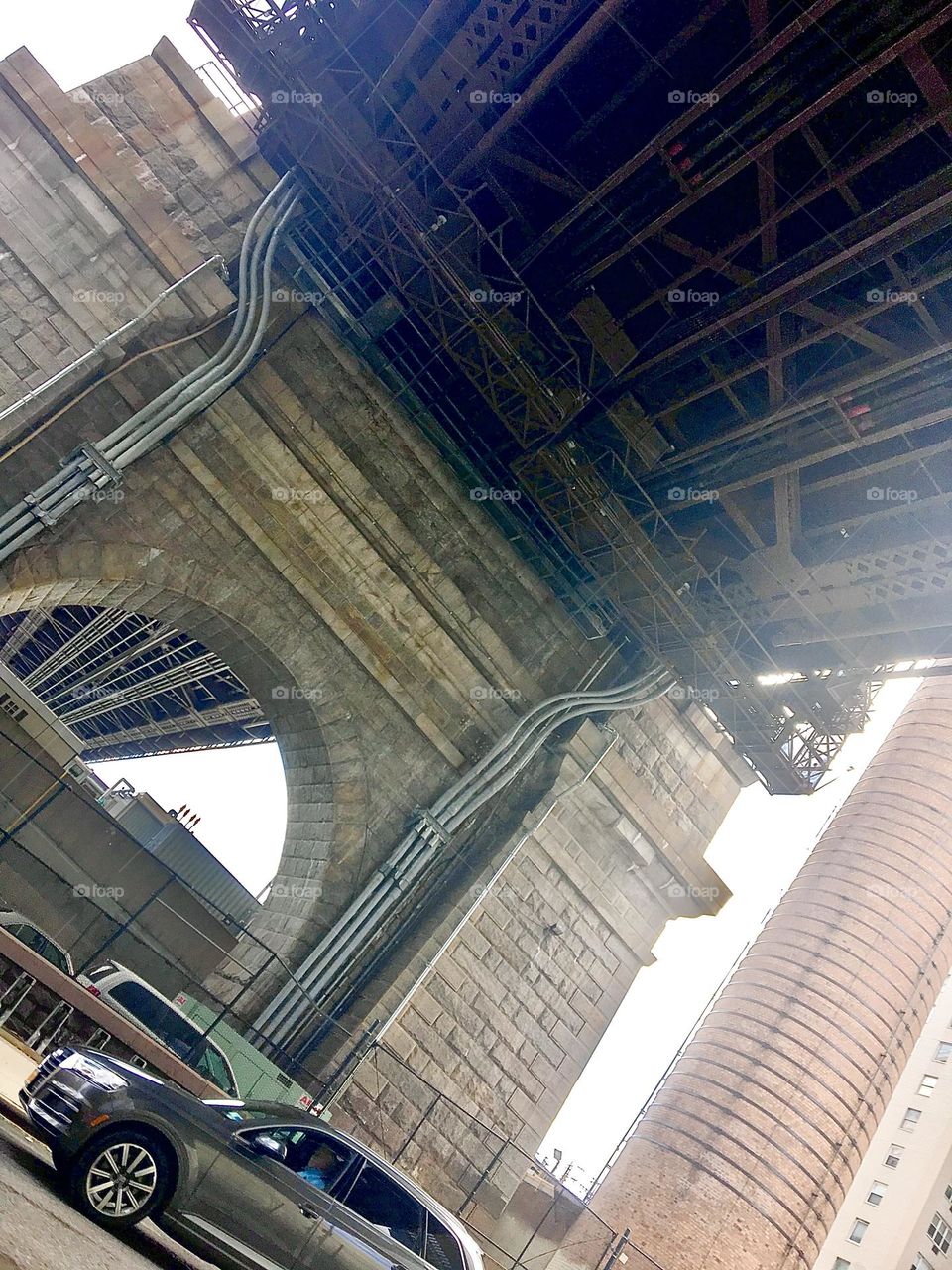 This is the arched structure of the Manhattan Bridge, a famous landmark in downtown New York City, in New York, NY in the district it was named after, Manhattan. 2020. Hypnotic Productions