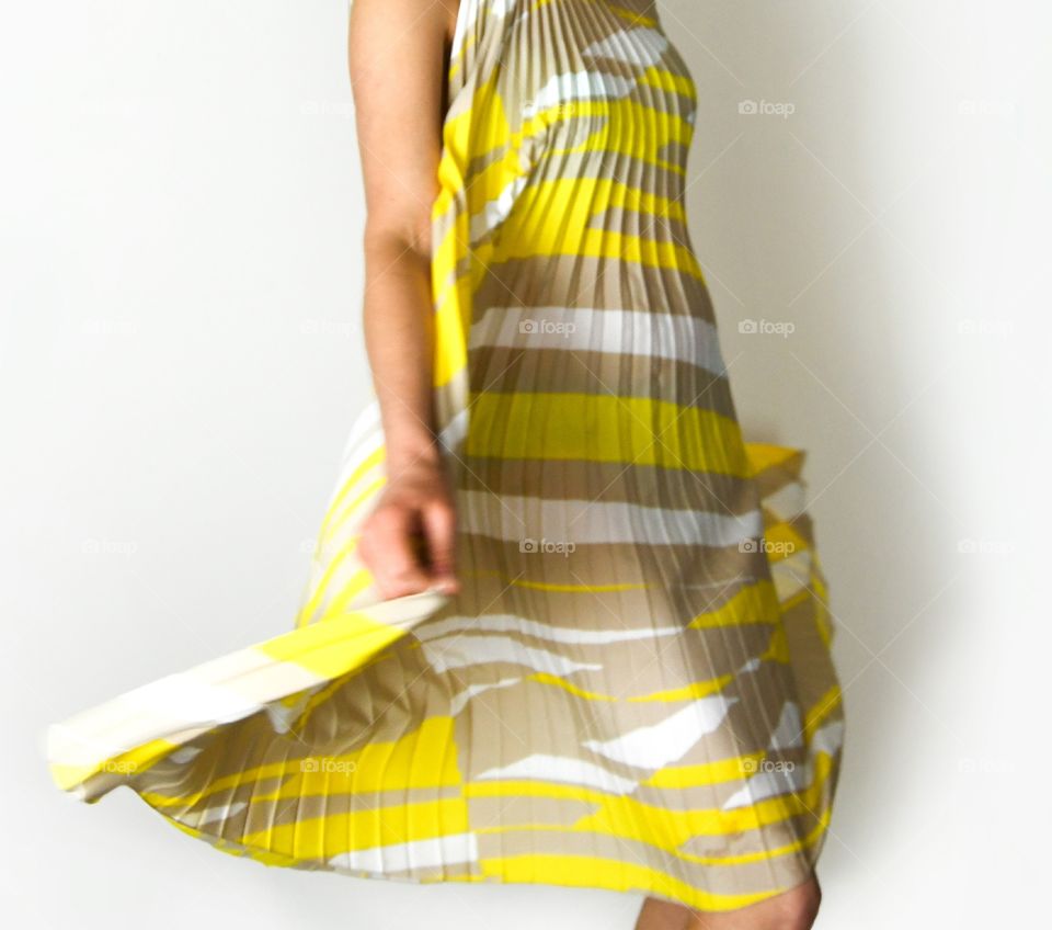 Beautiful, pleated yellow dress.