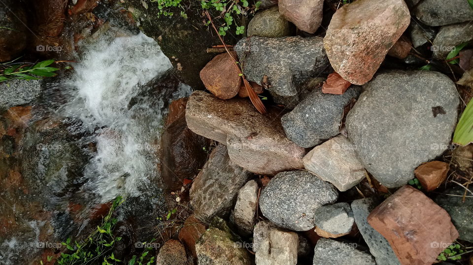 RIVER STONES WATER