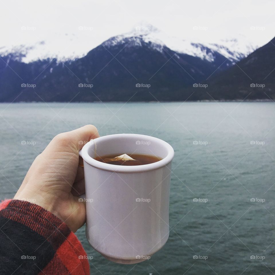 Steaming cup of tea on a cold day in the mountains
