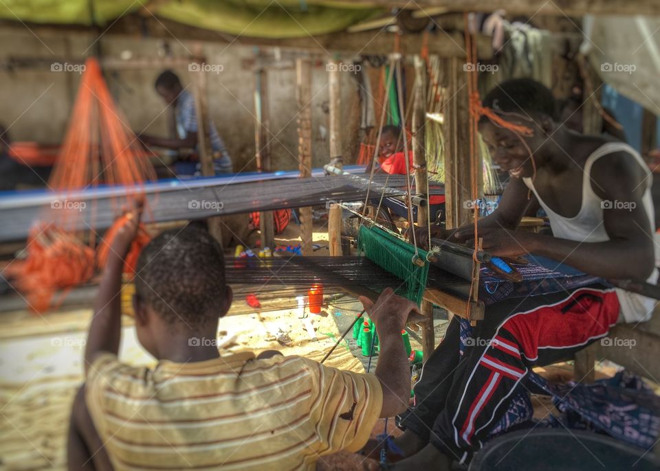 Worker working on loom