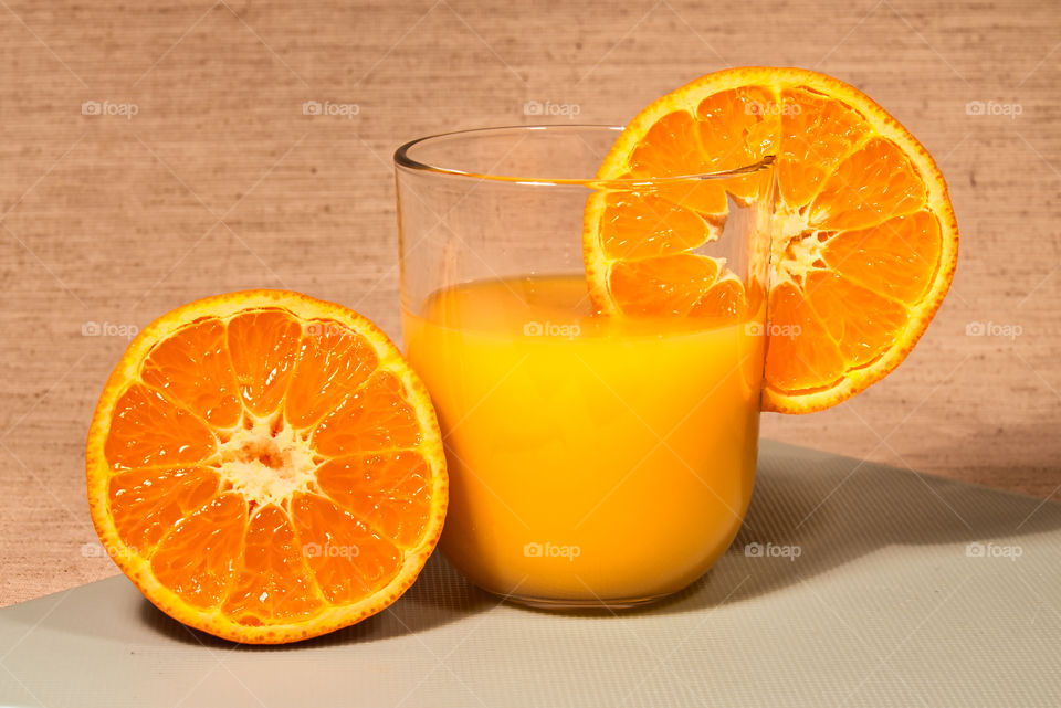 Healthy fresh orange juce and oranges