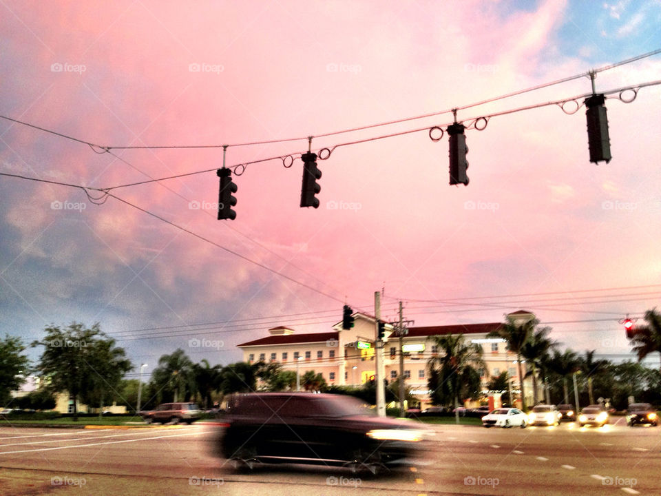 Car rushing in the street at sunset