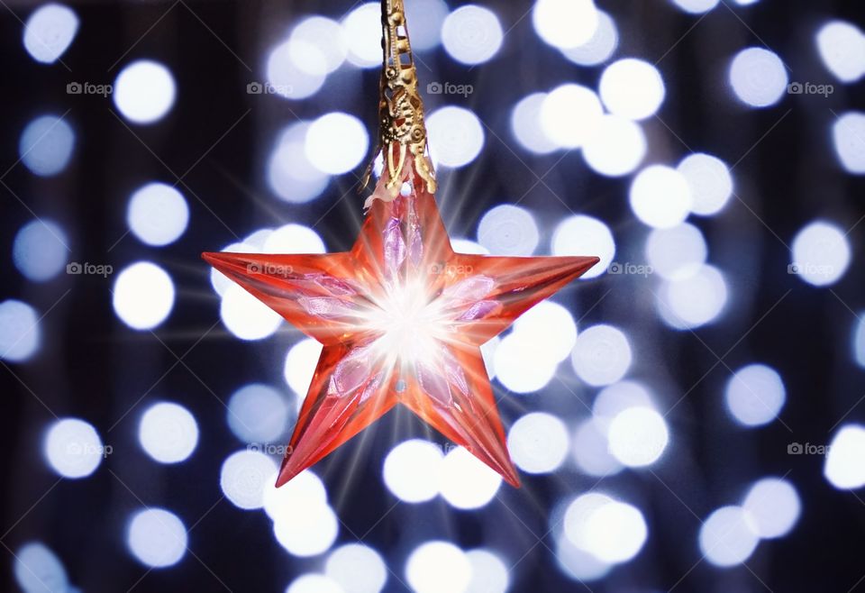 Star decor celebration christmas decoration garland lights illuminated blur background glitter shine