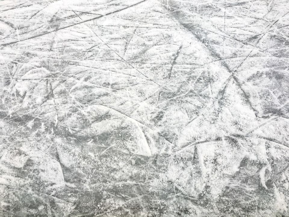 Frozen ice on lake after ice skating