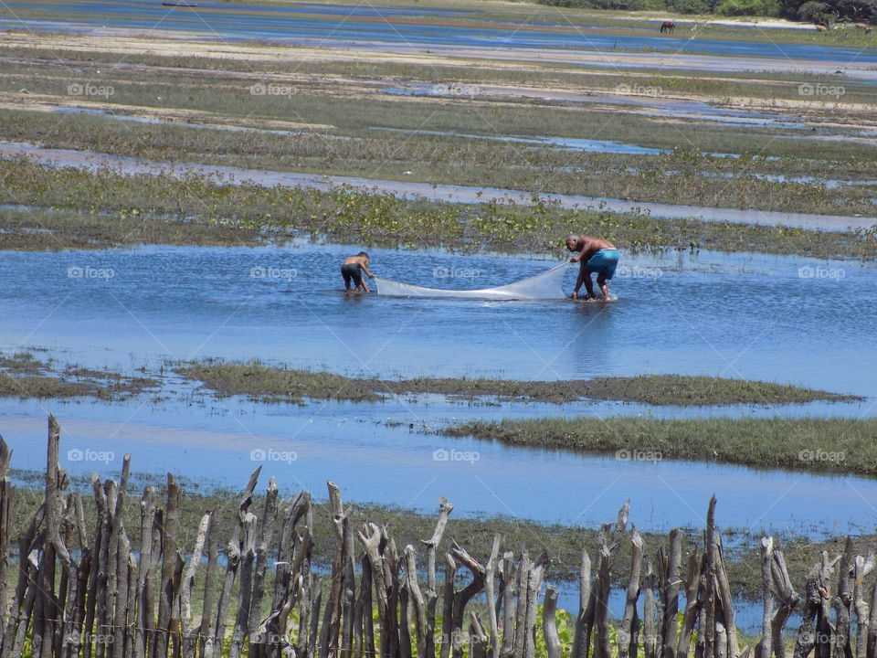 Fisherman in the lagoon in Santo Amaro do Maranhão. Maranhão Brazil.