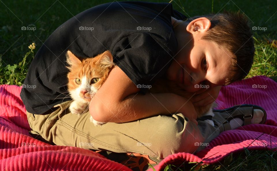 child with ginger cat outdoor family, love pet