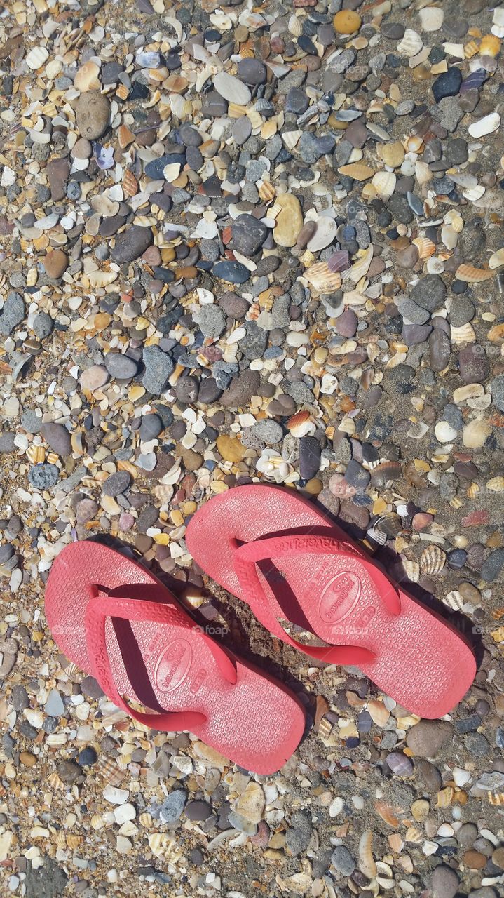 slippers on a rocky beach in France