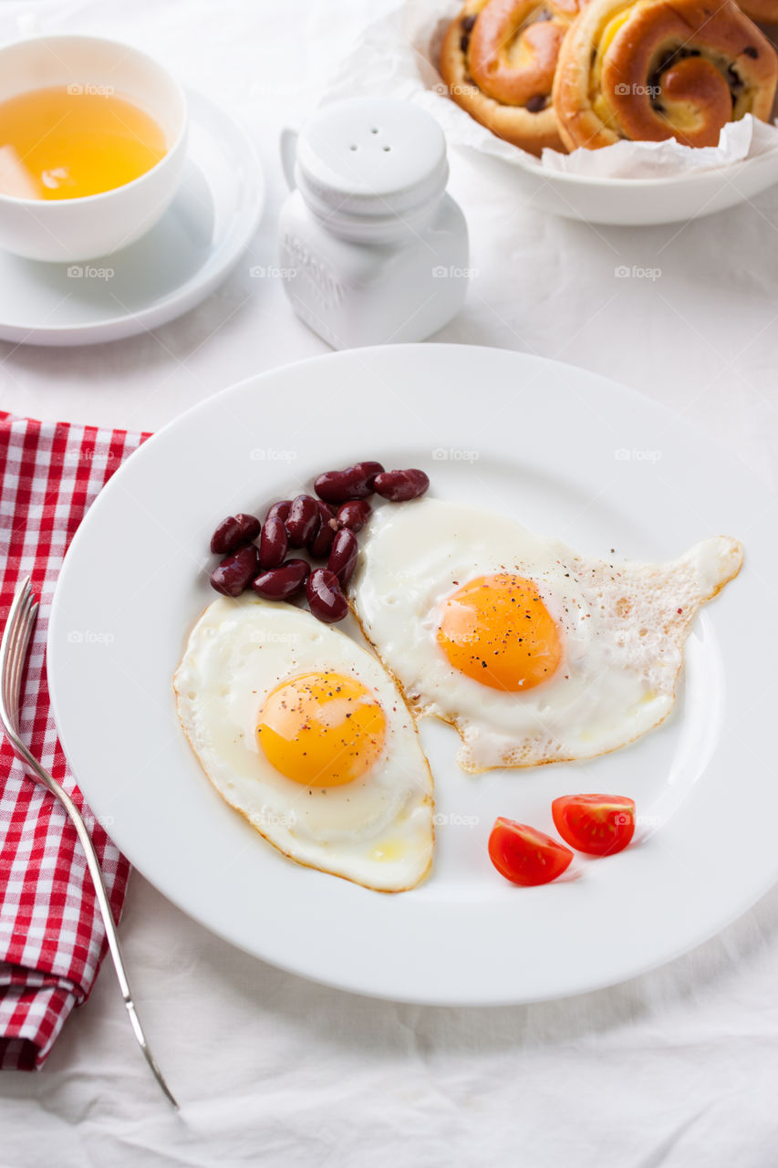 Eggs, beans and small tomatoes for breakfast