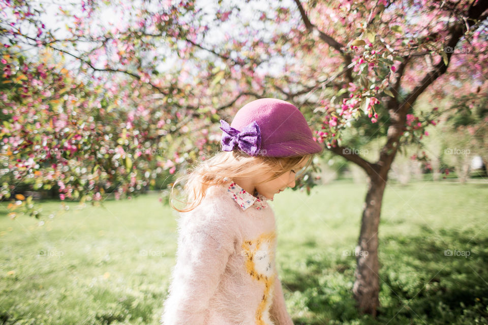 Cute Little girl in a blossom park