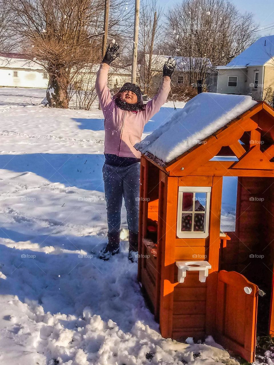 Throwing up the snow on a white winter day