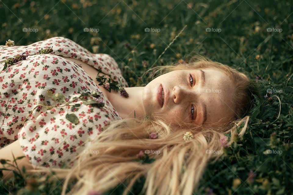 portrait photo of a young woman in nature