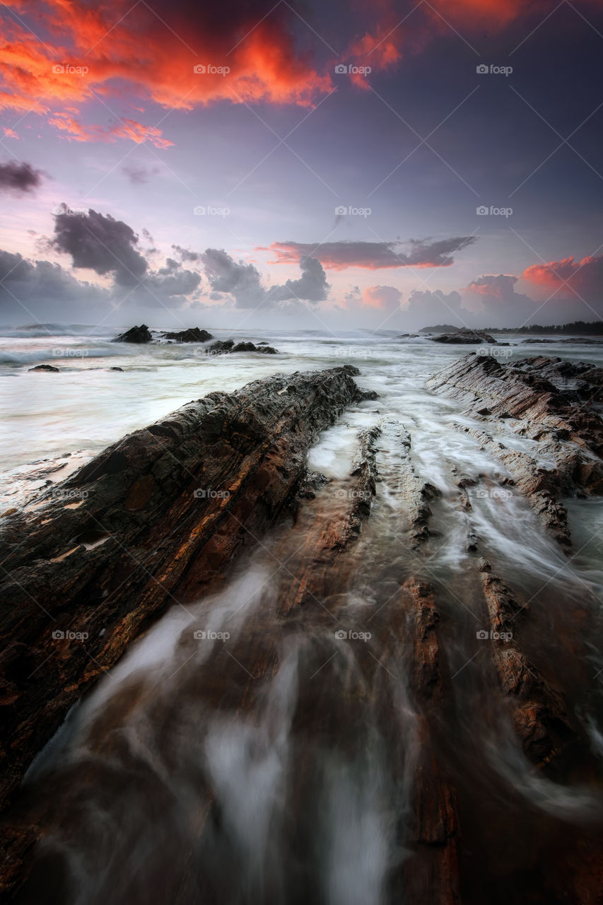 Sunrise over the rocky beach