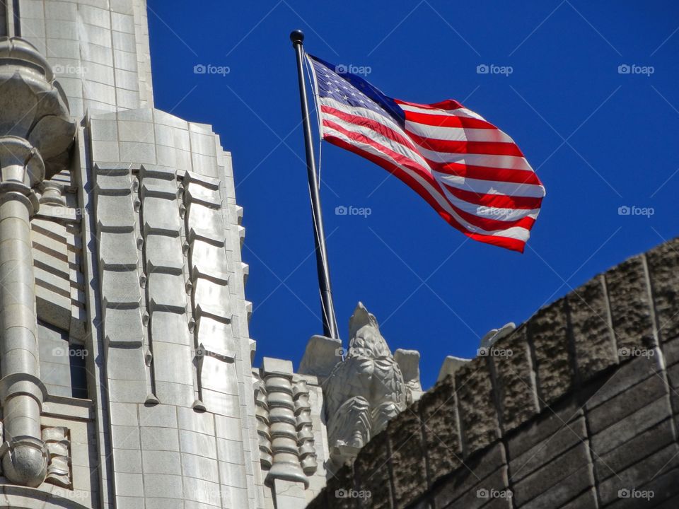 America Flag Flying Over Art Deco Building
