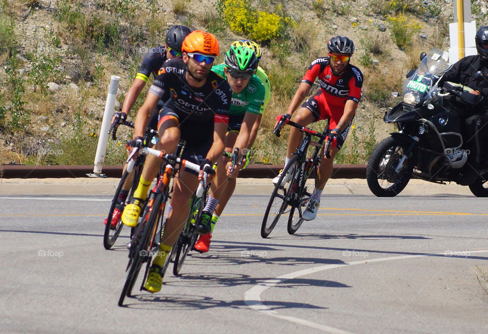 U S Pro Challenge bicycle race. 5 leaders round the corner leaving Buena Vista for Fairplay