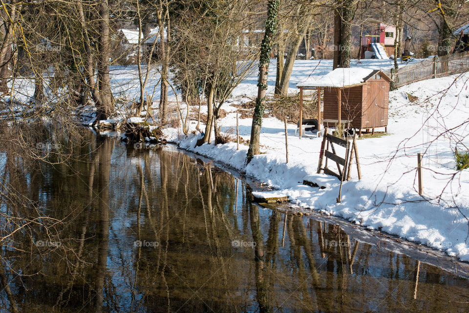 View of log cabin in snow covered winter