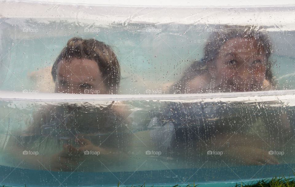 Two kids in the pool