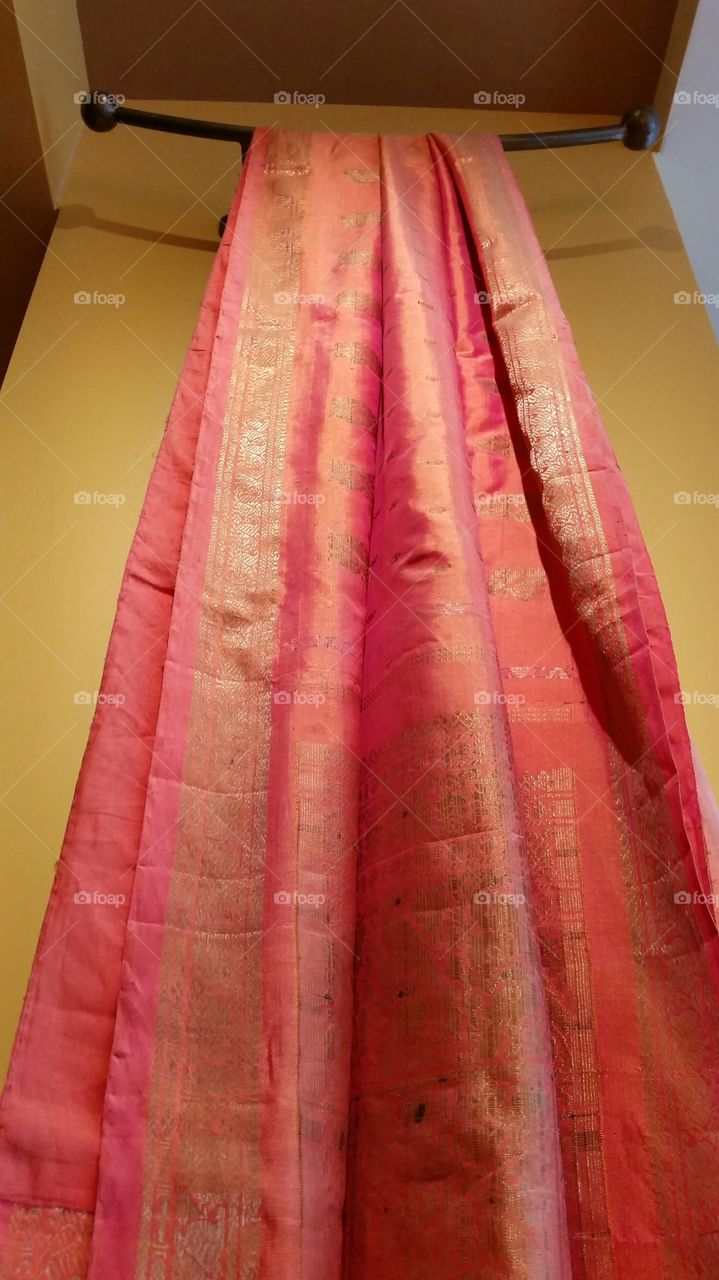 Saree, silk fabric with golden brocade, to be wrapped around the waist