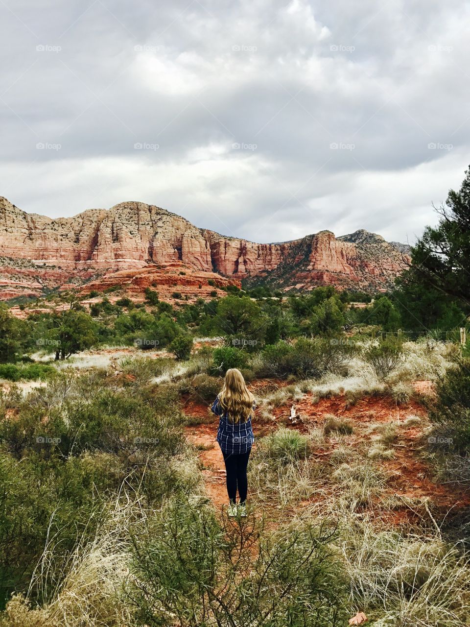 Girl looking at Red Mountains