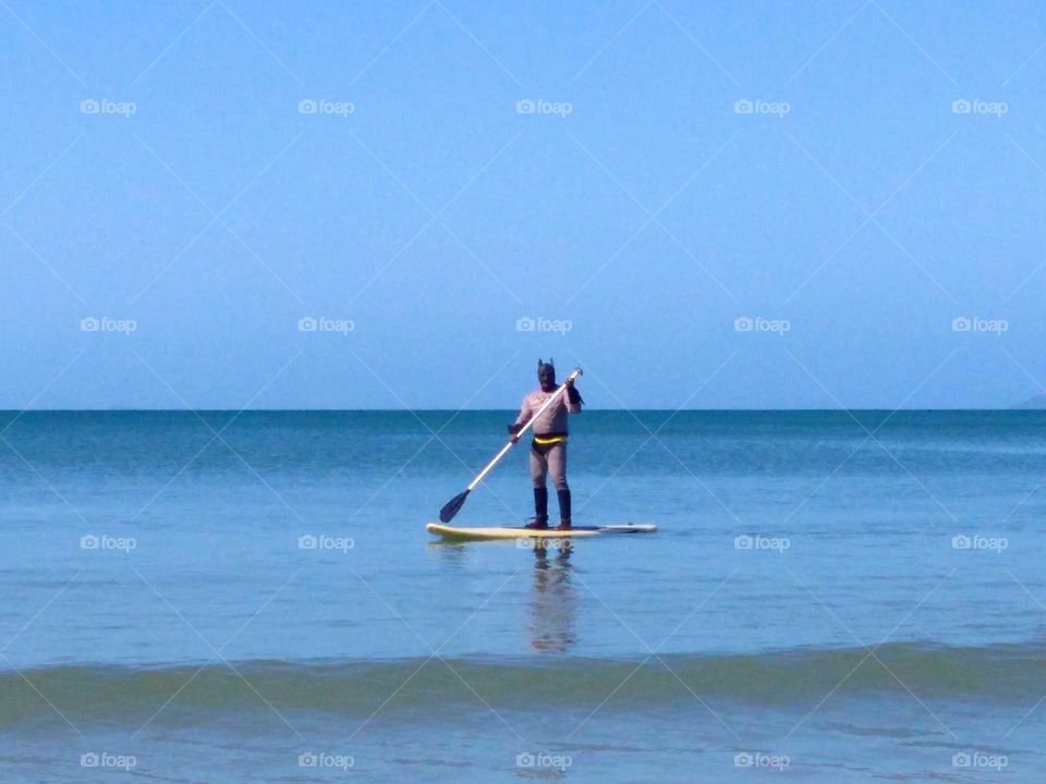 Batman in stand up paddle