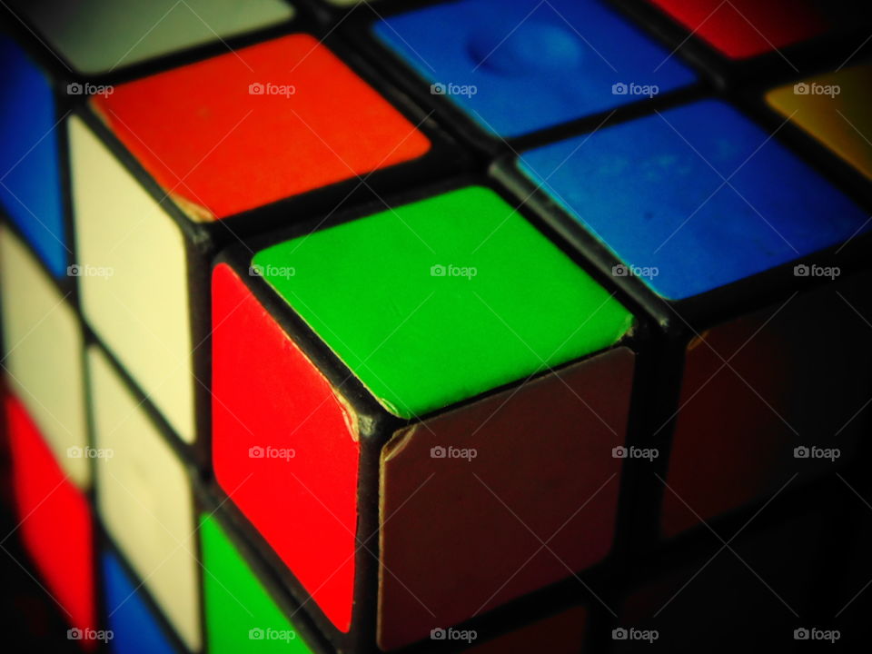 A Colouring Rubik Cube picture with a corner close up view ( green,orange, red corner)