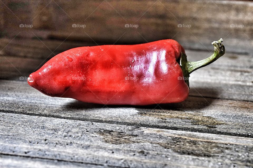 Red chilli pepper on wood