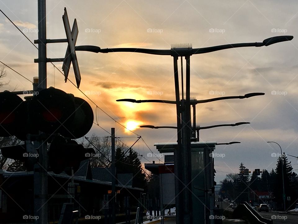Sunset at train station with vibrant sky