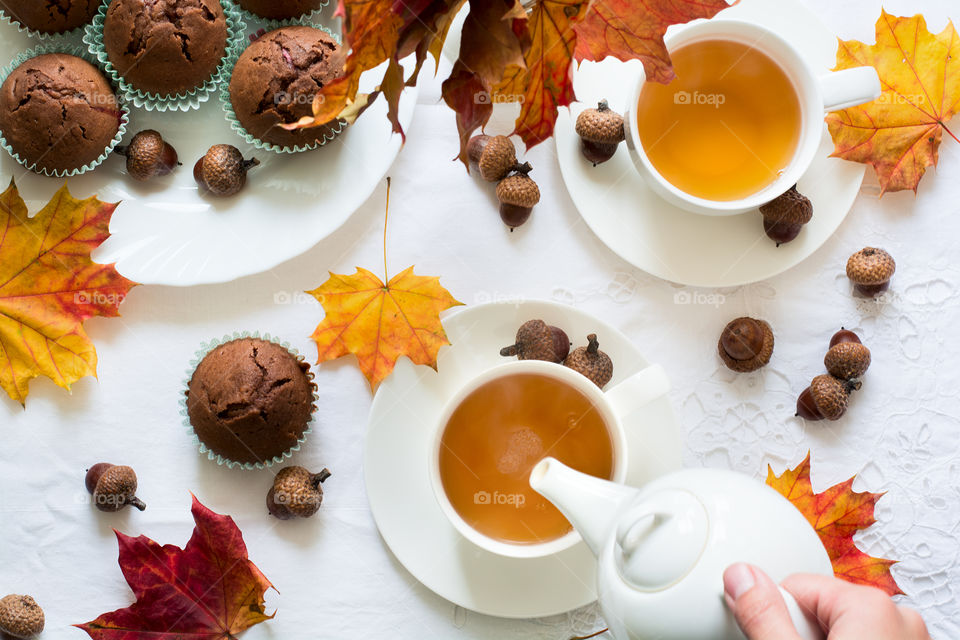 Two cups of tea with autumn decor